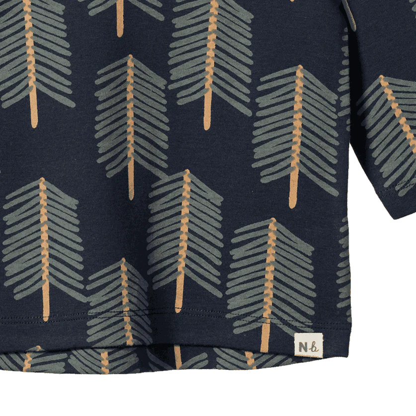 Navy blue fabric with geometric pattern and brand label on a white background
