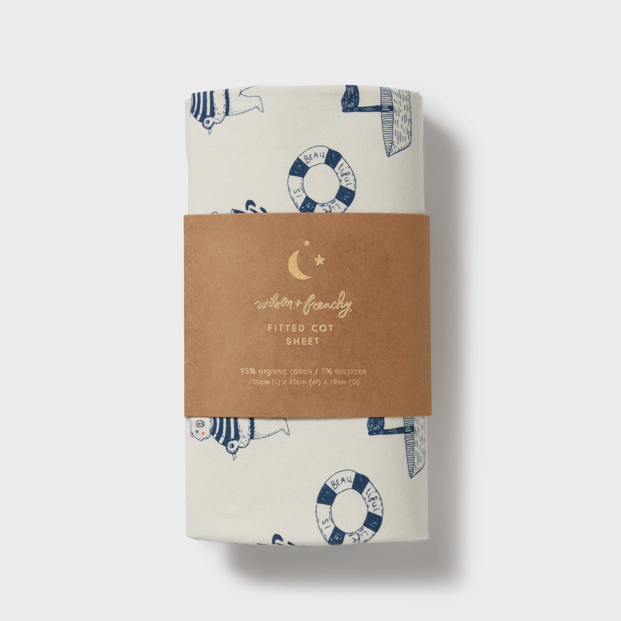 Fitted cot sheet with nautical pattern and brown label on a white background