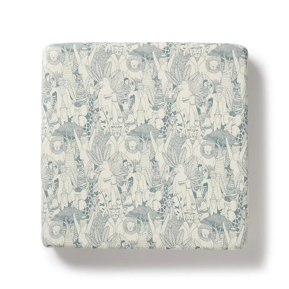 Patterned fabric swatch with abstract designs on a light background