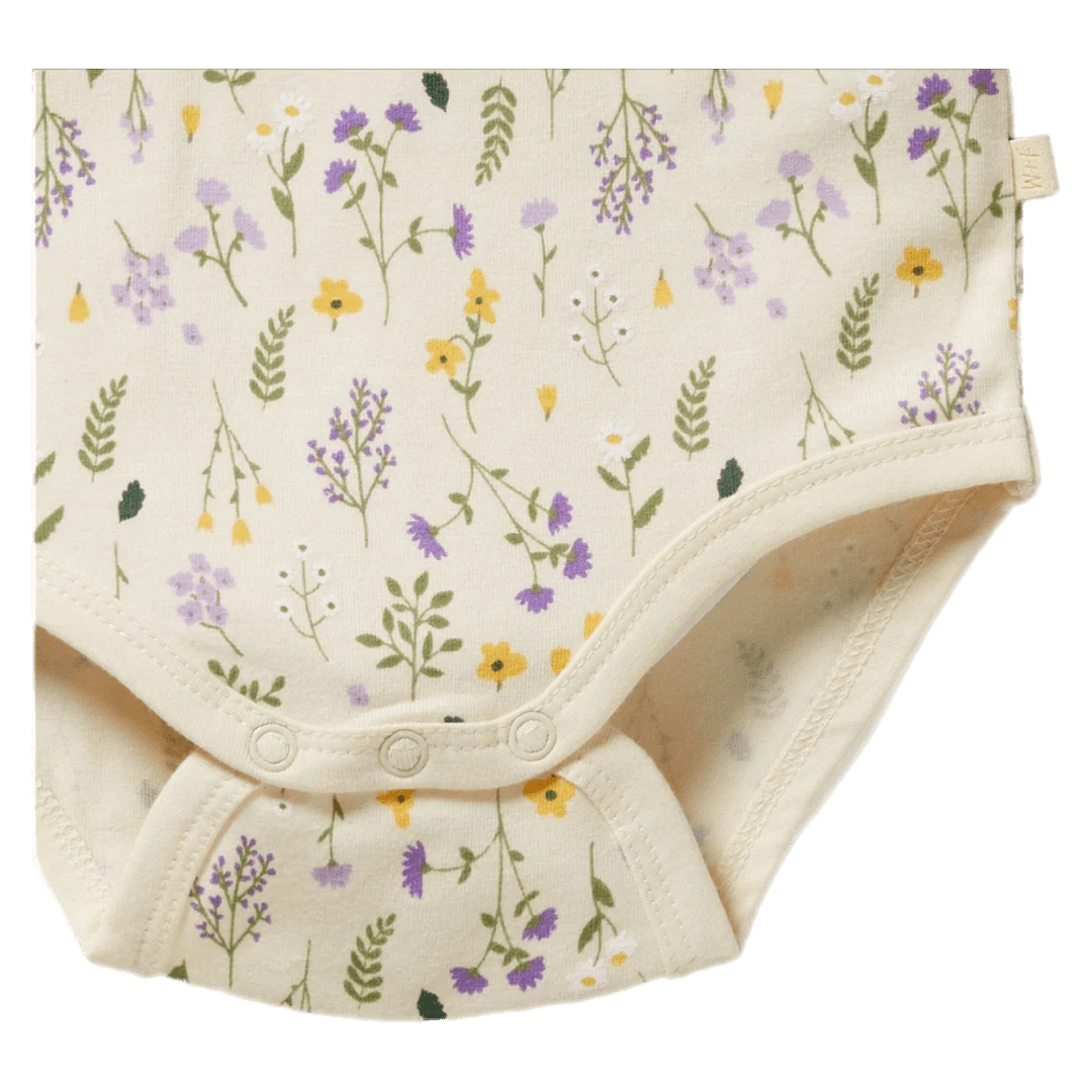 Baby romper with floral pattern on a white background