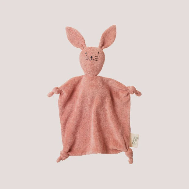 Pink bunny plush toy on a light pink background