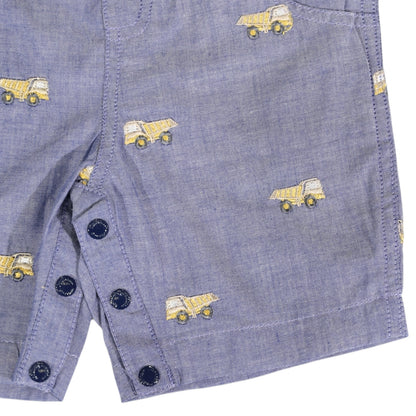 Blue denim shorts with yellow dump truck pattern and black buttons on a white background