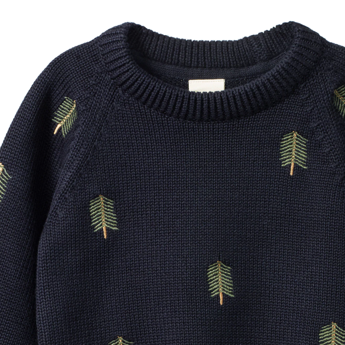 Navy sweater with green leaf patterns on a white background