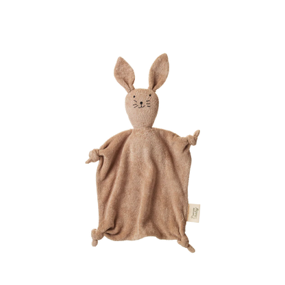 Brown knitted bunny comfort blanket on a white background