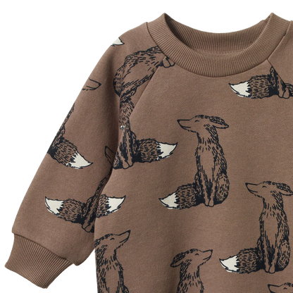 Brown sweatshirt with fox pattern on a white background