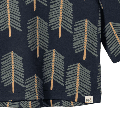 Navy blue fabric with geometric pattern and brand label on a white background