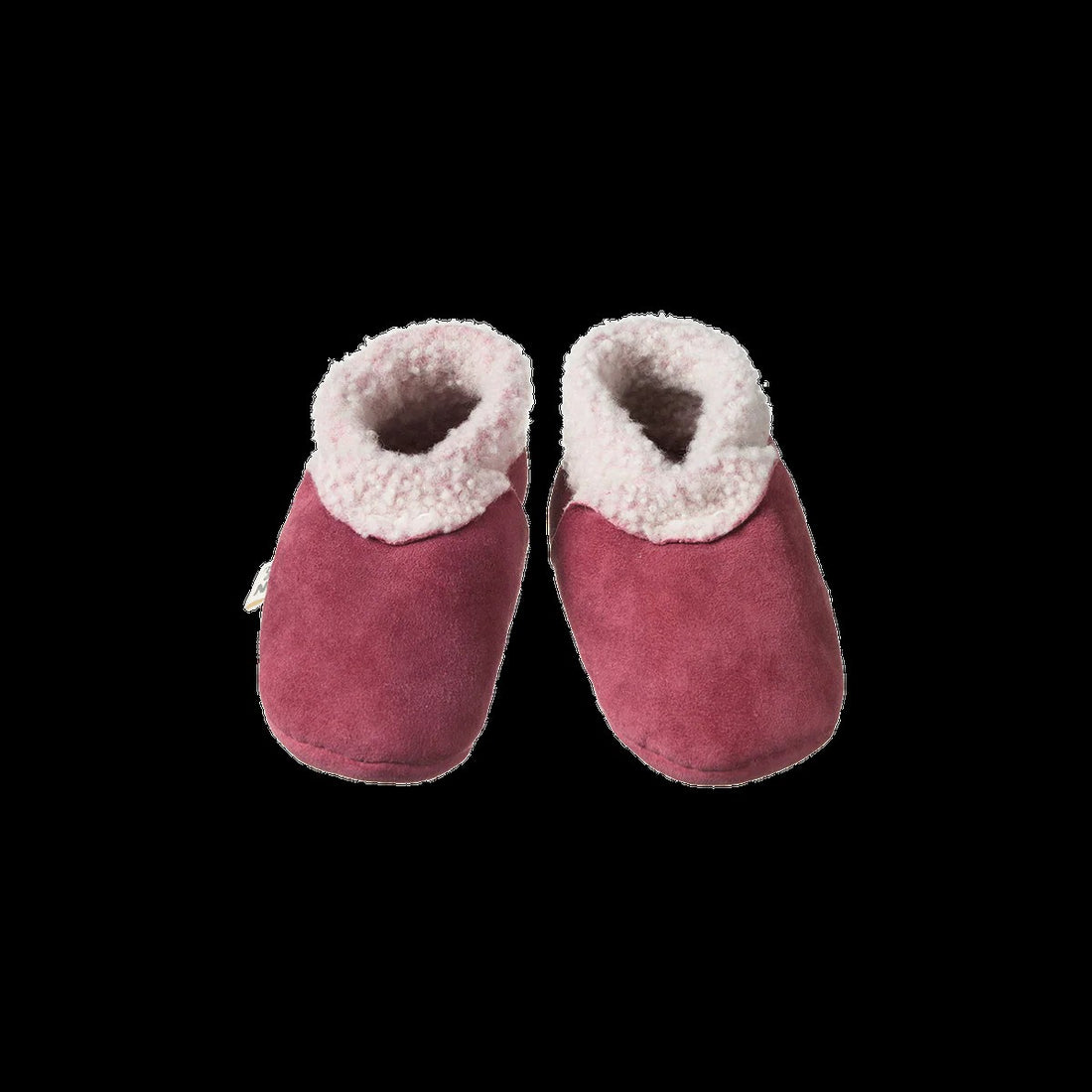 Pair of pink baby booties with white fur trim on a black background