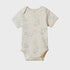 Baby onesie with green elephant pattern on a white background
