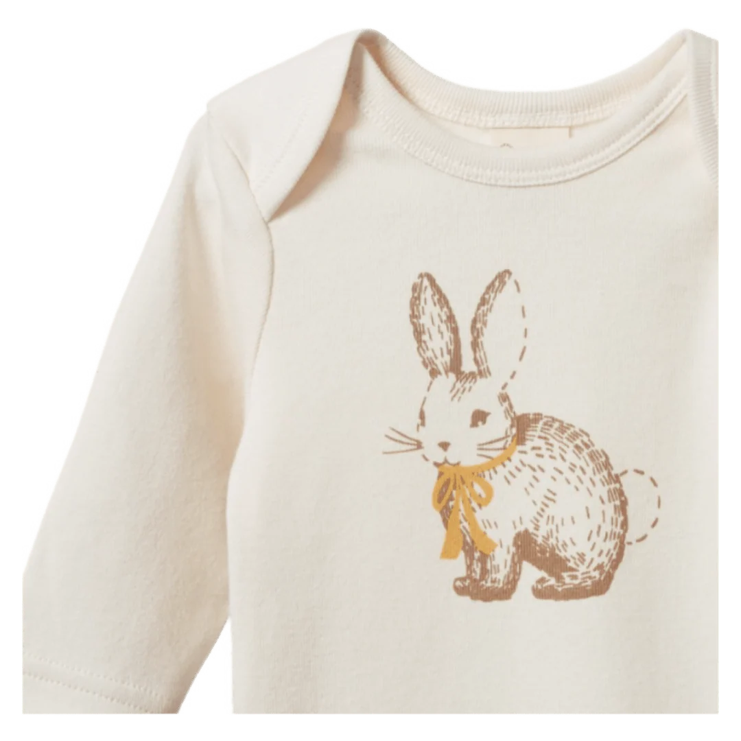 Baby onesie with a printed bunny design on a white background