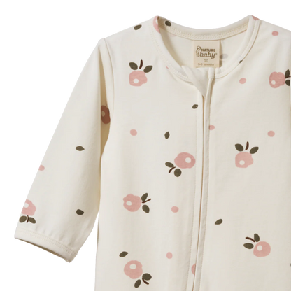 Baby onesie with floral pattern on a white background