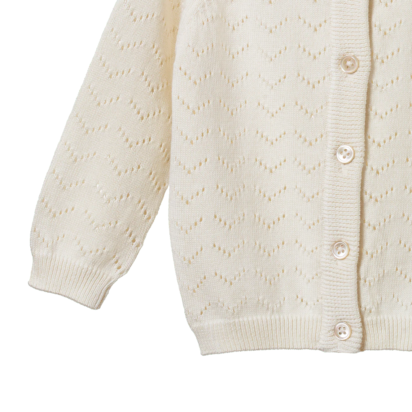 Close-up of a cream-colored cardigan with button details on a white background