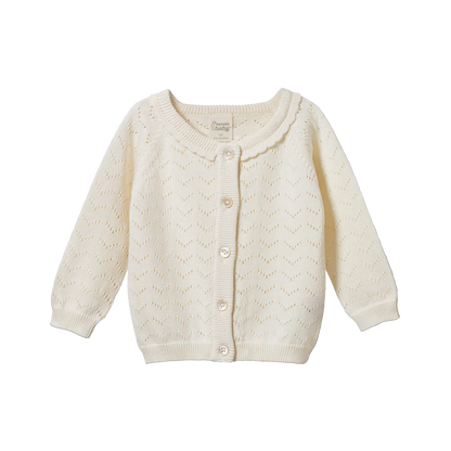 Cream-colored baby cardigan on a white background