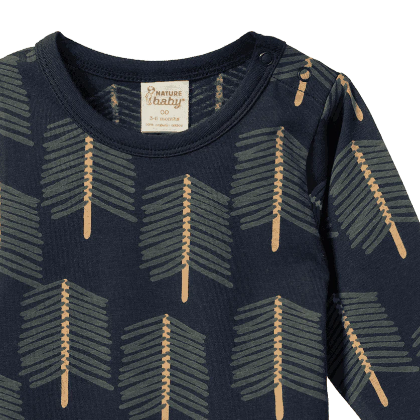 Navy blue baby onesie with arrow pattern and &