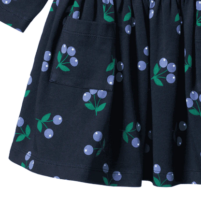 Black dress with blueberry pattern on a white background