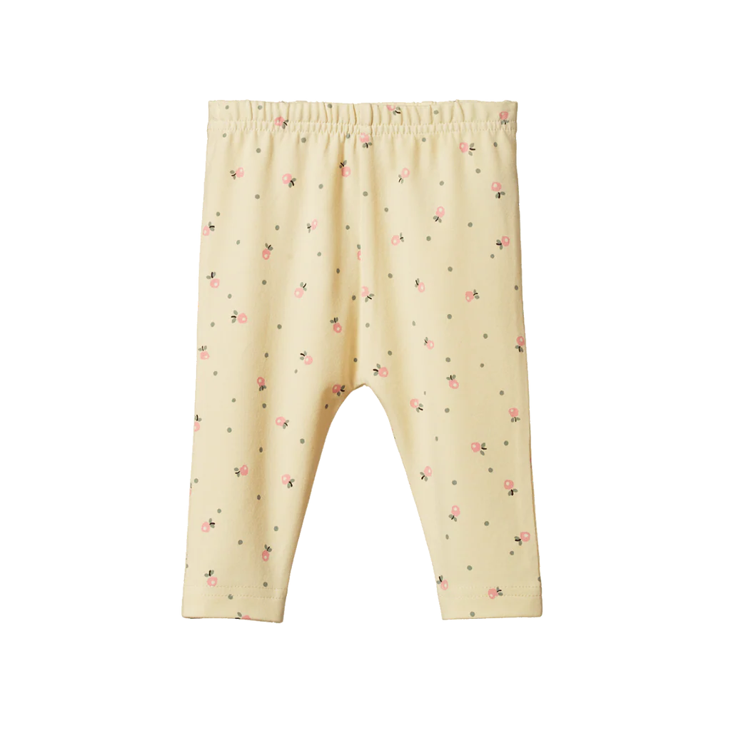 Cream-colored baby leggings with a subtle pattern on a white background