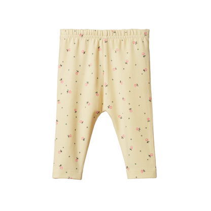 Cream-colored baby leggings with a subtle pattern on a white background