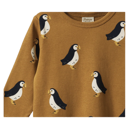 Brown sweater with penguin pattern on a white background