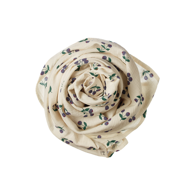 Rolled-up fabric with floral pattern on a white background
