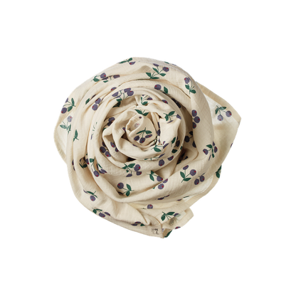 Rolled-up fabric with floral pattern on a white background