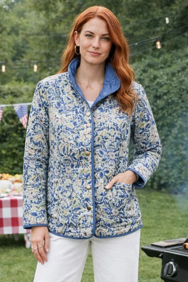 Woman wearing a blue and white patterned jacket outdoors