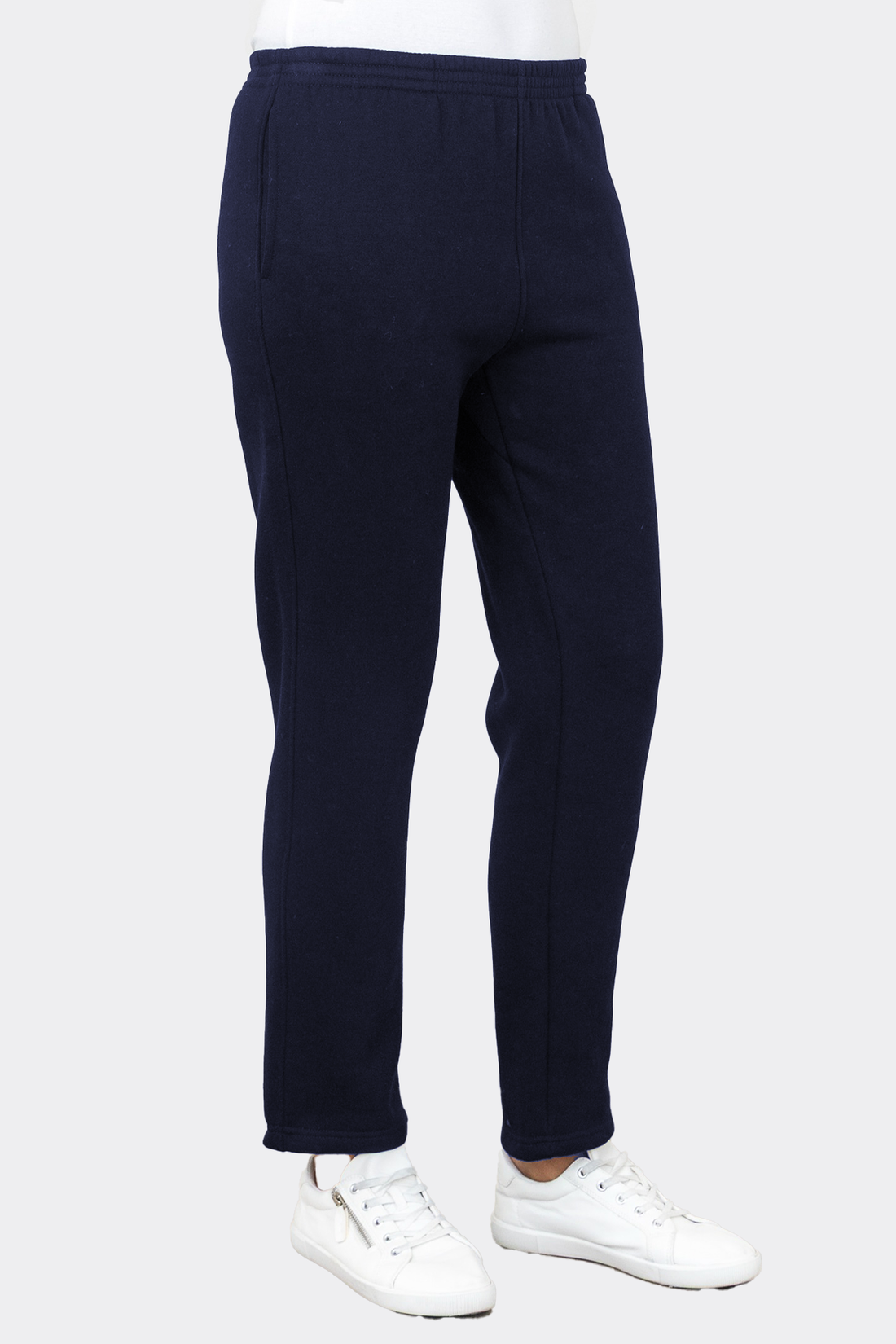 Navy blue sweatpants worn by a person on a white background