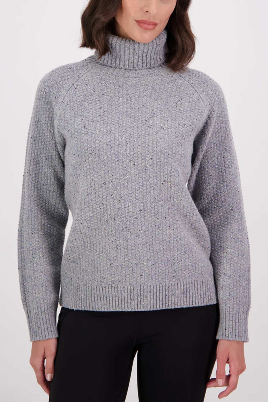 Woman wearing a gray knitted sweater on a white background