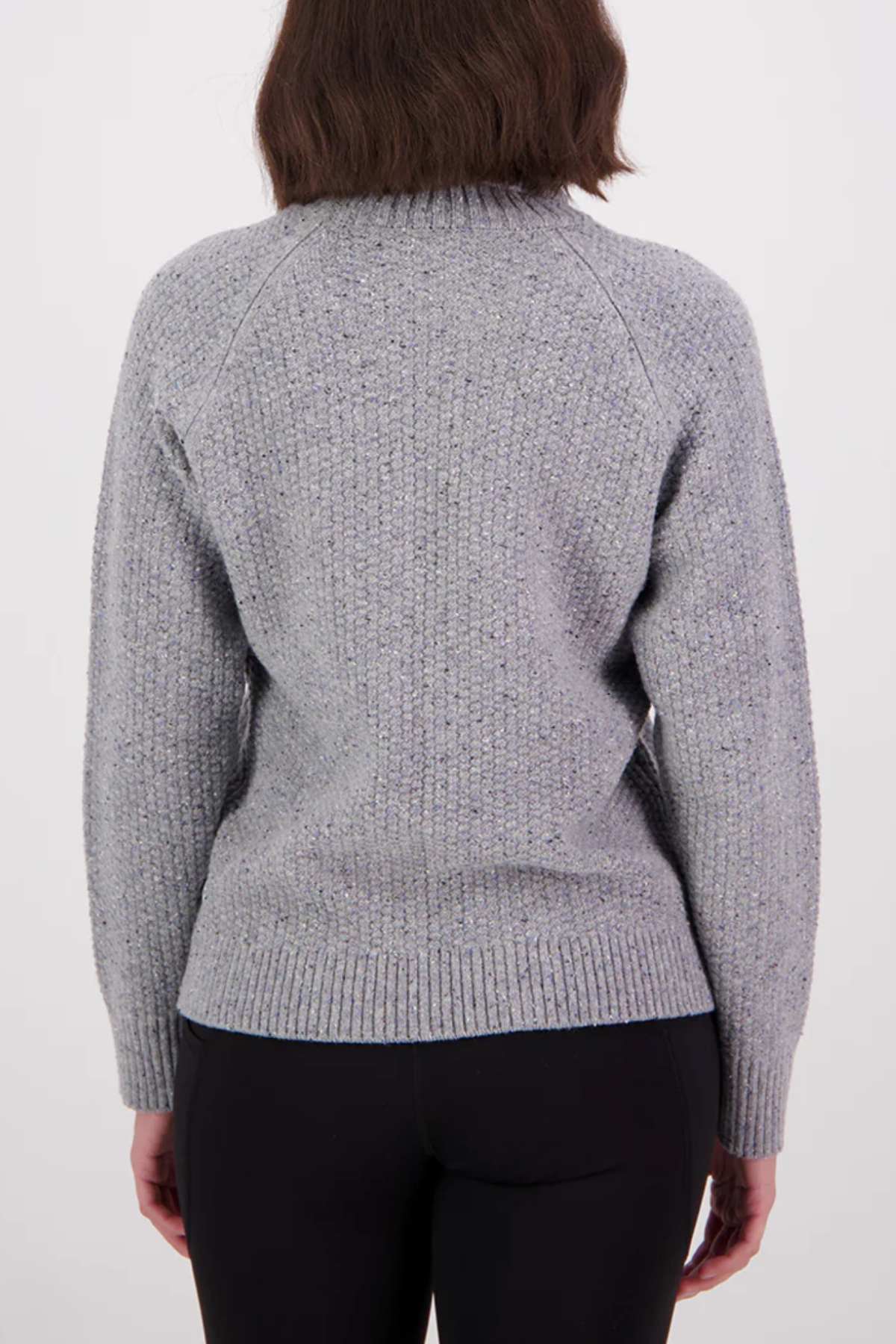 Person wearing a gray sweater on a white background
