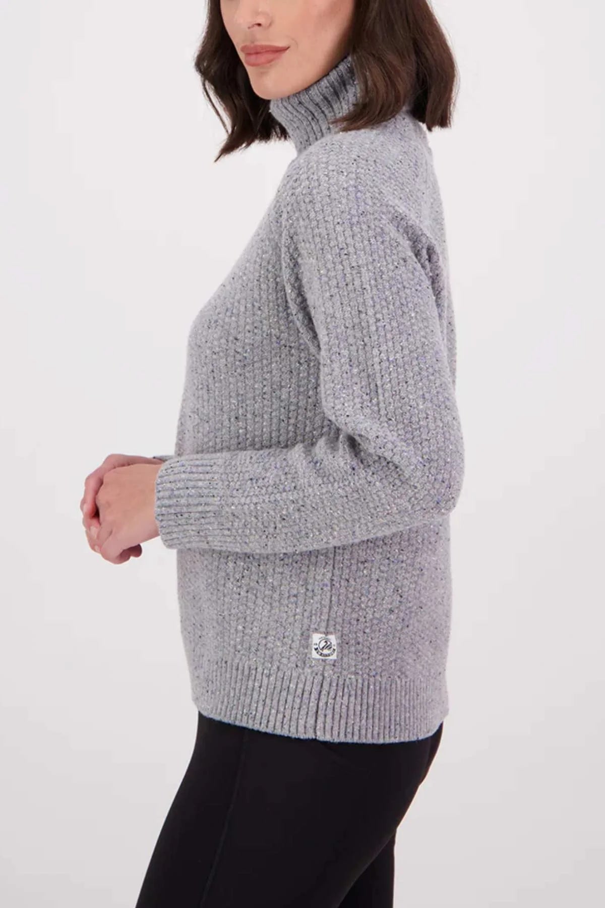 Person wearing a gray knitted sweater on a white background