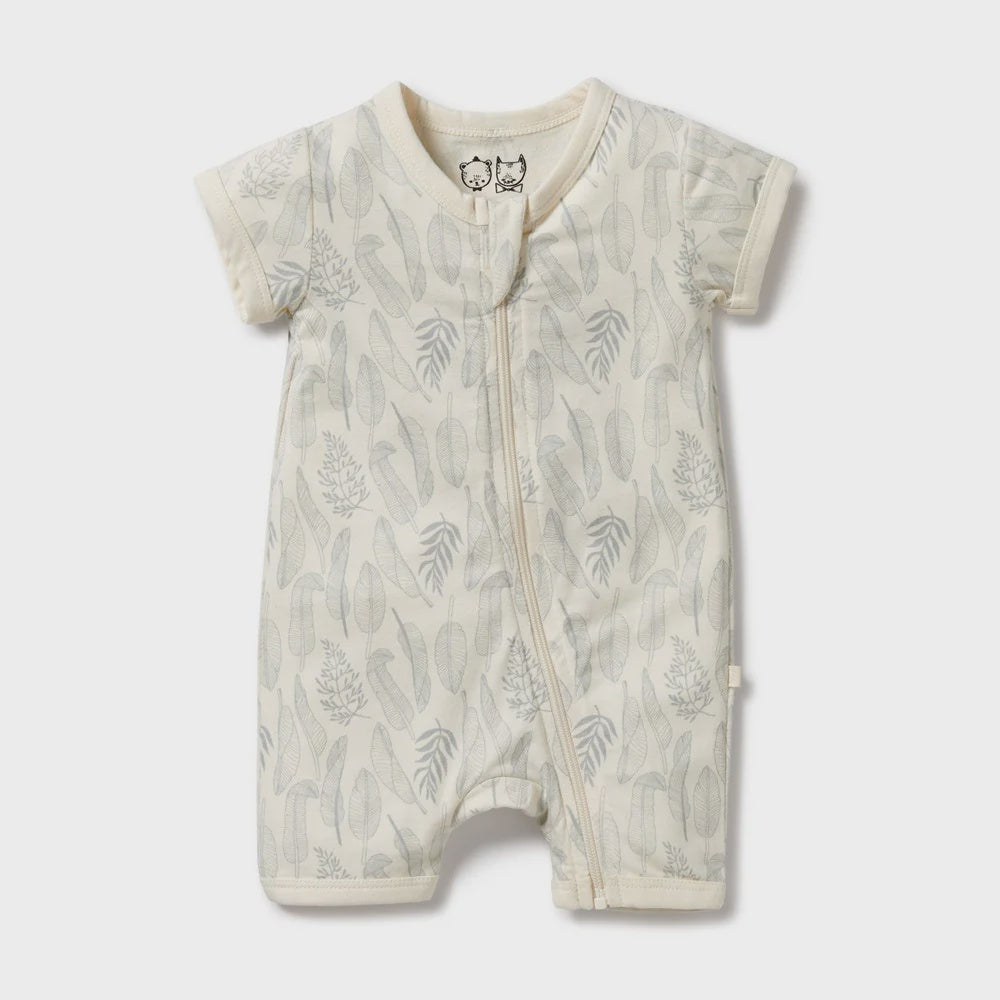 Baby romper with leaf pattern on a white background