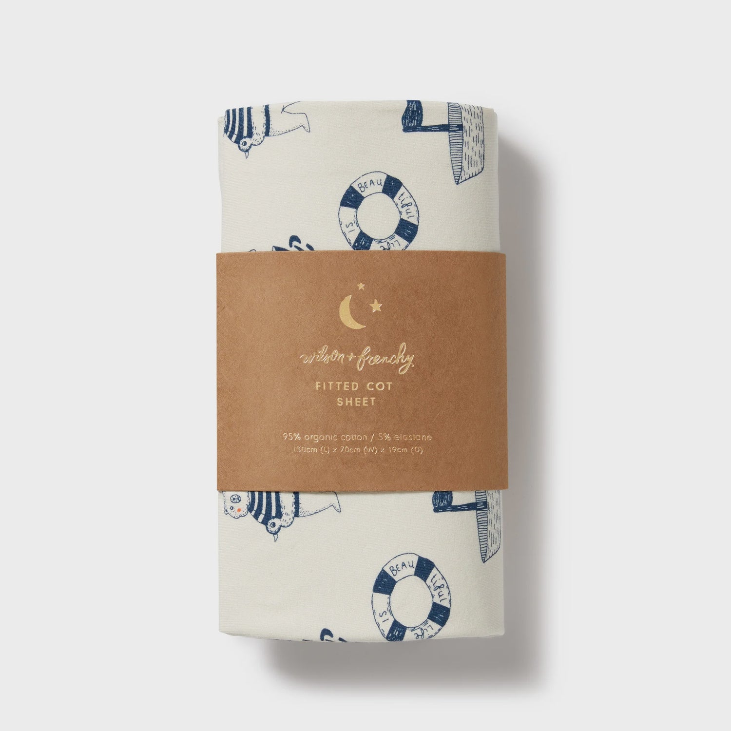Fitted cot sheet with nautical pattern and brown label on a white background