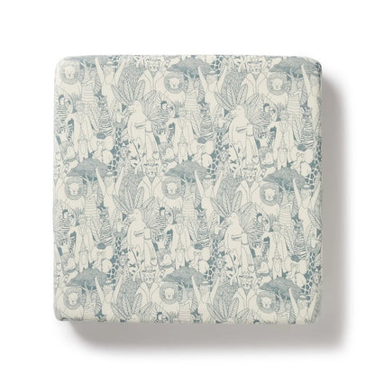 Patterned fabric swatch with abstract designs on a light background
