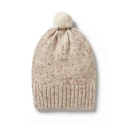 Beige knit beanie with a white pom-pom on a white background