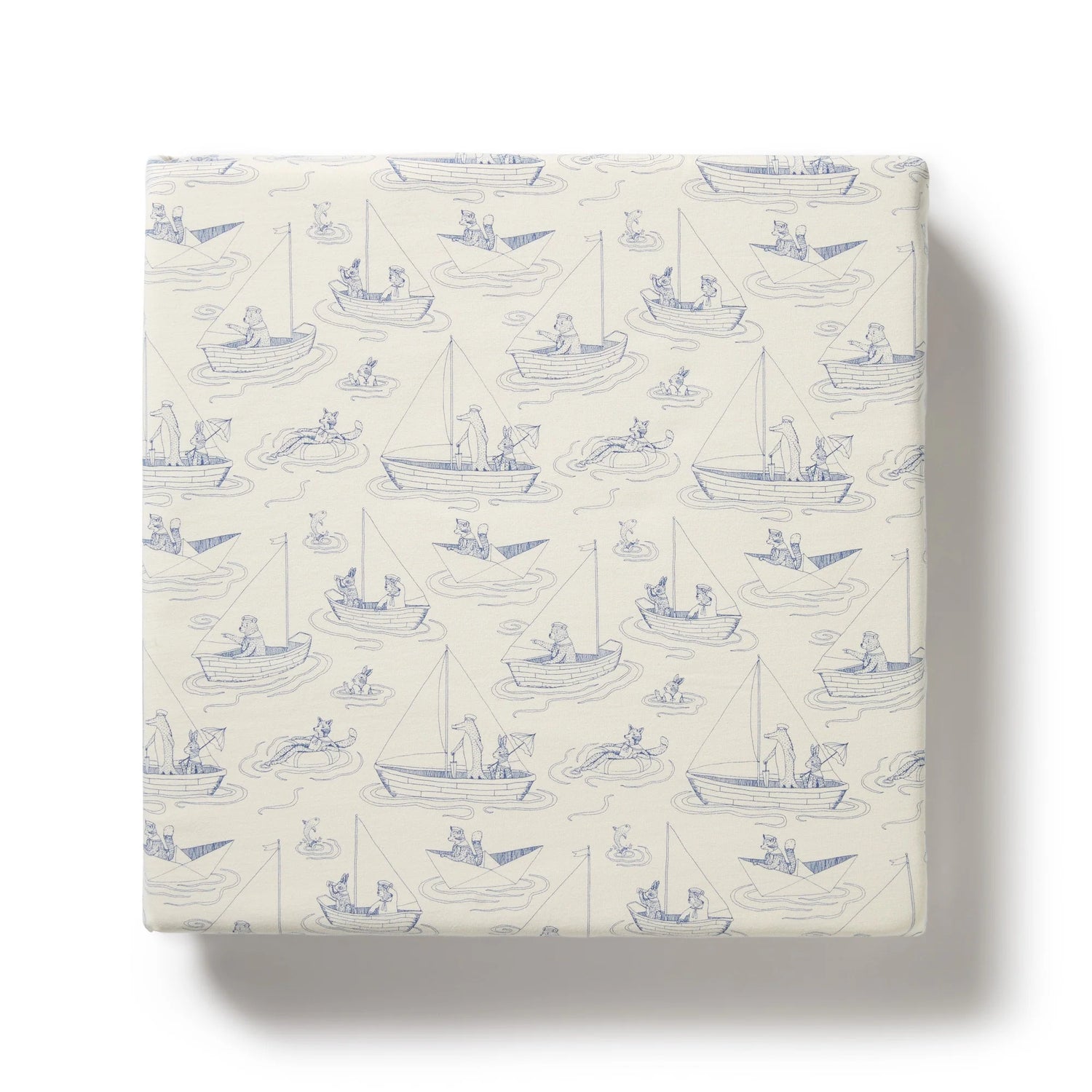 Packaged product with blue boat pattern on a white background