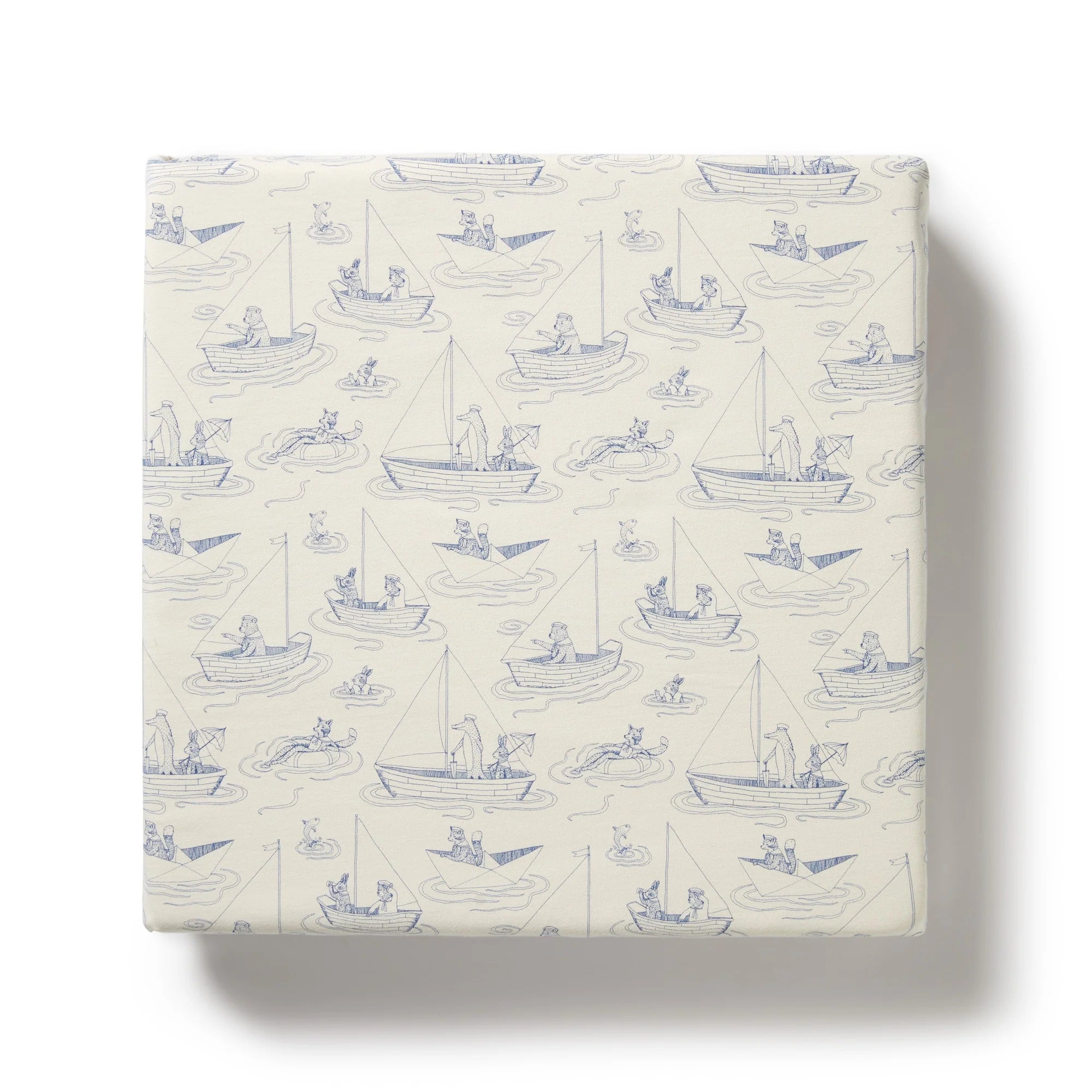 Packaged product with blue boat pattern on a white background
