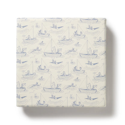 Packaged product with blue boat pattern on a white background