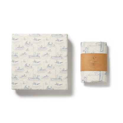 Packaged product with a pattern of small boats on a white background