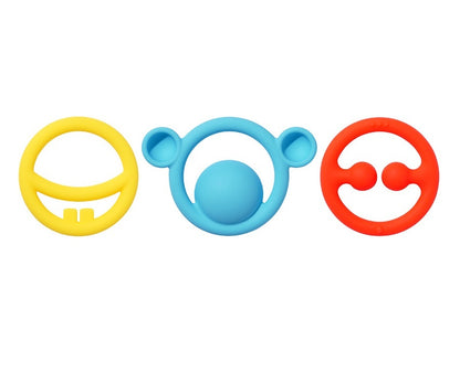 Three colorful silicone teething rings on a white background