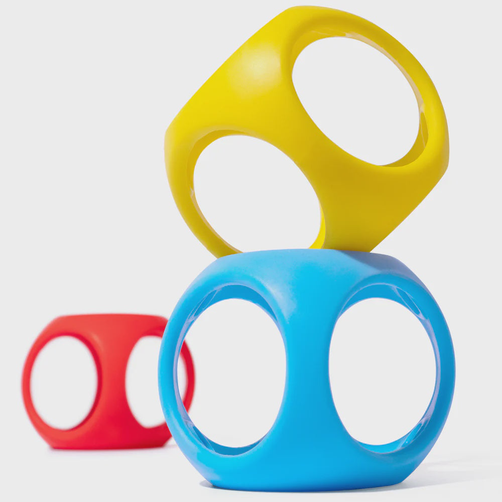 Three colorful fidget spinners in yellow, blue, and red on a white background