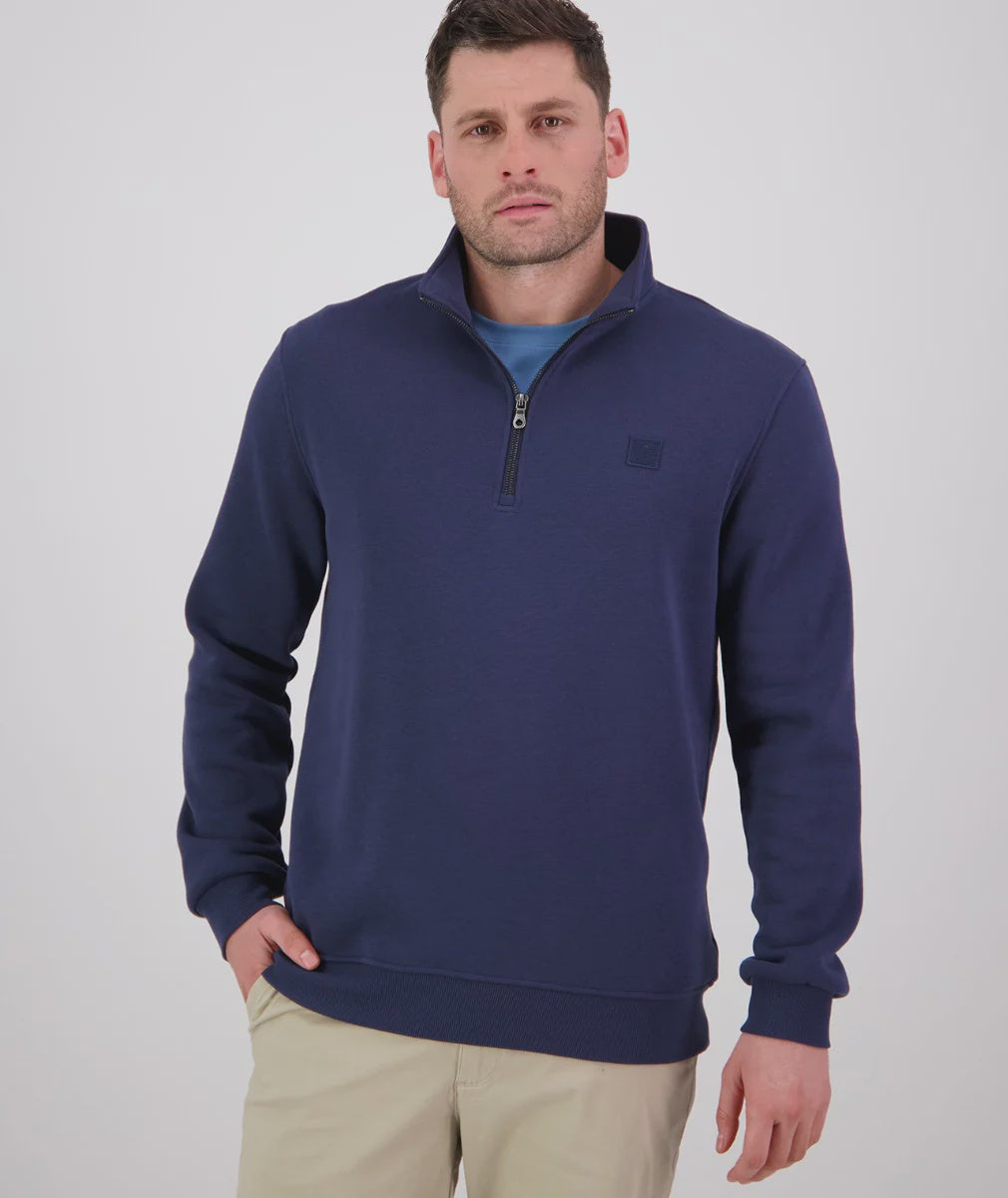 Man wearing a swandri navy blue pullover with a small logo on a white background