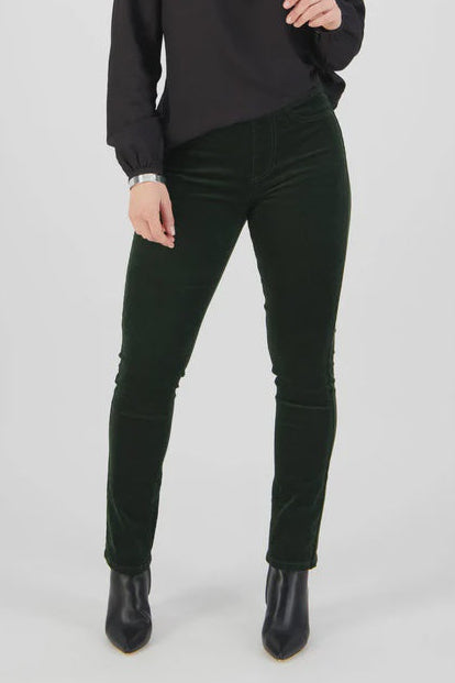 Person wearing a black sweater and black pants on a white background