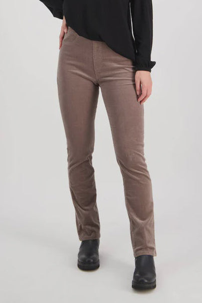 Woman wearing a black top and  on a white Taupe Cords from Vassalli on a white background