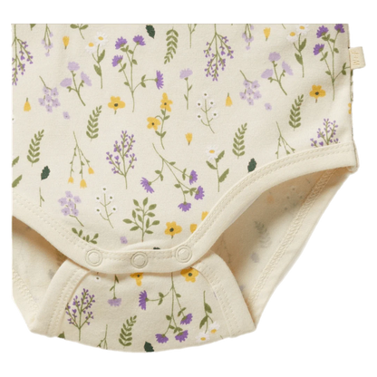 Baby romper with floral pattern on a white background